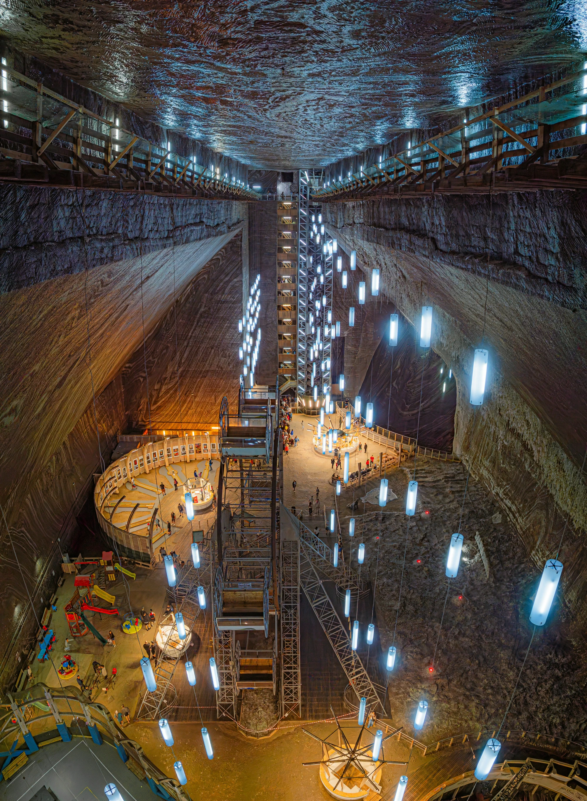 Turda Salt Mine vast underground chamber with illuminated structures and lake